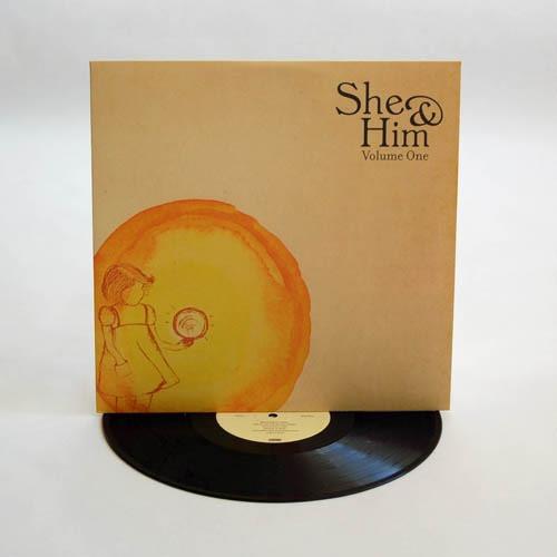 Tan vinyl record sleeve with a watercolor illustration of a girl and a sun