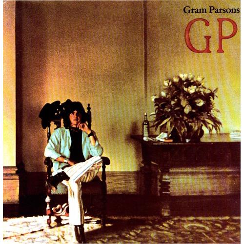Vinyl LP cover featuring a man in a light blue shirt seated in a wooden chair