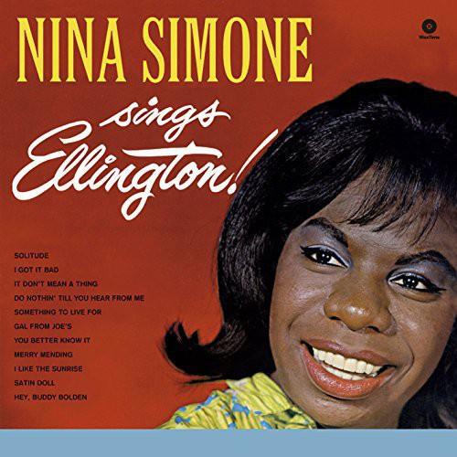 Vinyl LP cover featuring a close-up portrait of Nina Simone smiling against a red background