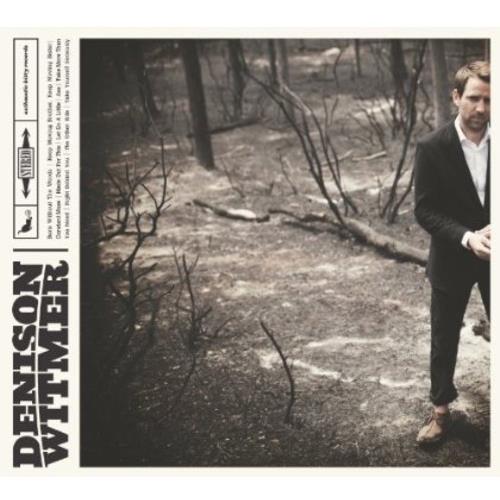 Vinyl LP cover featuring a man in a black suit standing in a wooded area