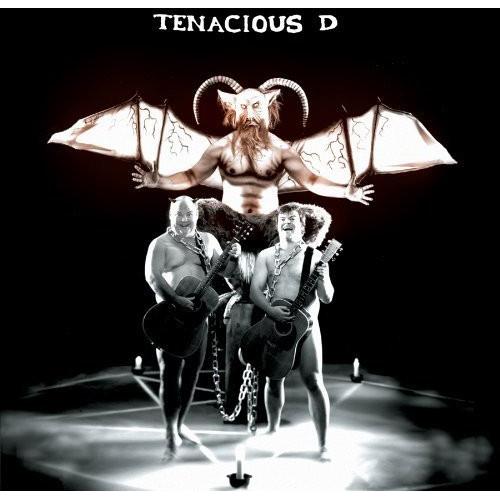 Two shirtless men playing acoustic guitars beneath a winged, horned demon figure