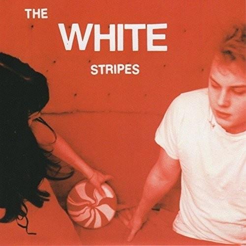 Orange vinyl single cover featuring a man and woman reaching for a red and white peppermint candy