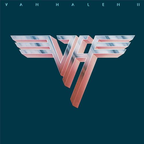 Dark teal vinyl album cover featuring a metallic winged logo with chrome and pink gradients