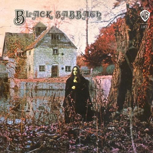Vinyl LP cover featuring a cloaked figure standing before a stone house by a lake
