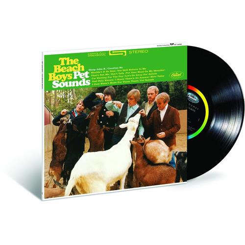 Green and white album cover featuring five men posing with goats and a sheep
