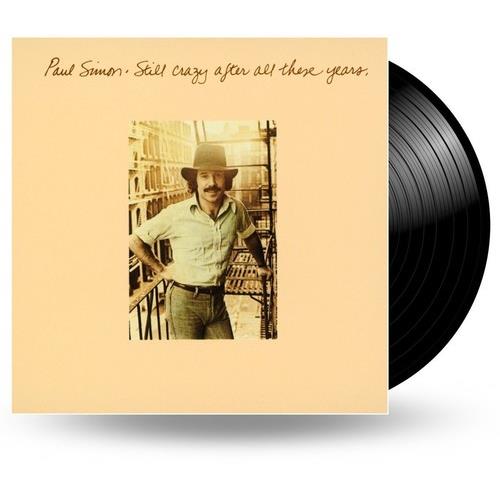 Beige album cover featuring a man in a hat and light shirt leaning on a fire escape
