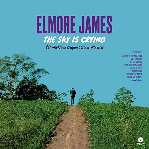 Blue vinyl record cover featuring a man walking down a dirt path through a green field