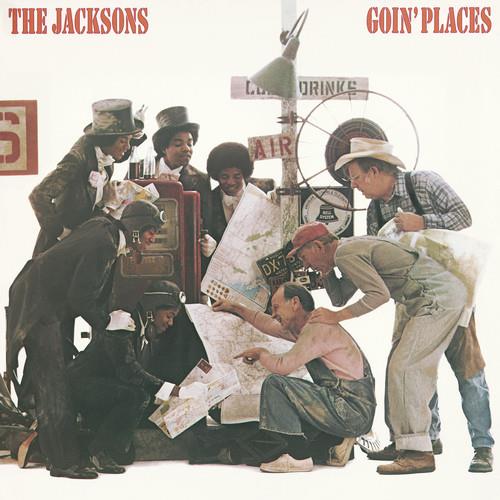 Album cover art featuring a group of men gathered around a map and vintage luggage
