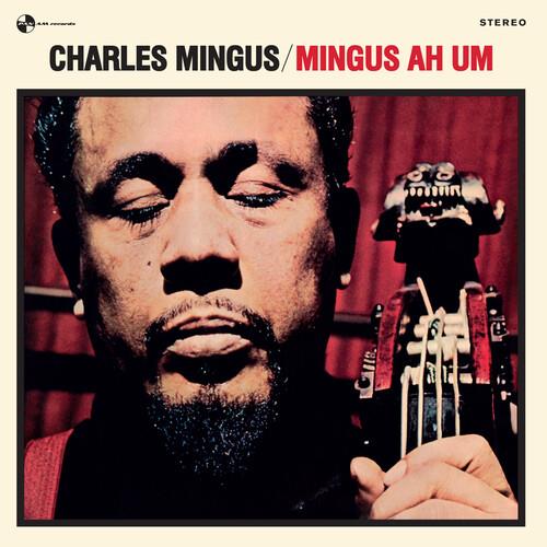 Vinyl LP cover featuring a close-up portrait of a man with closed eyes holding a double bass