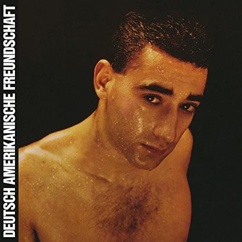 Vinyl LP cover featuring a close-up portrait of a shirtless man with wet skin and dark hair against