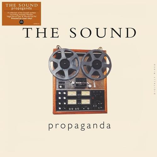 Vintage reel-to-reel tape recorder with dual spools on a cream album cover
