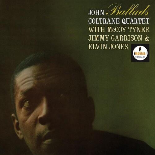 Vinyl LP cover featuring a close-up portrait of a man against a dark green background with gold and