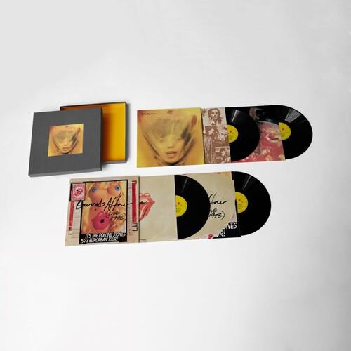 Deluxe box set with four vinyl records, lyric booklet, and art prints displayed on a white surface