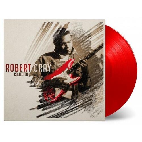 Red vinyl record partially removed from illustrated album sleeve featuring a guitarist