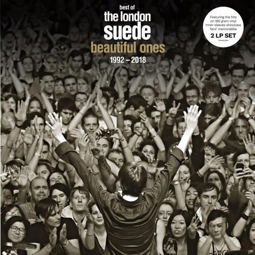 Black and white album cover showing a performer with raised arms facing a cheering crowd