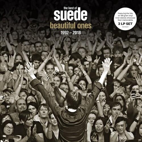 Black and white album cover showing a performer with raised arms facing a large crowd
