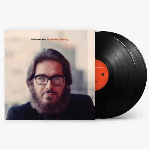 Vinyl LP with a portrait of a bearded man in glasses on the cover and two black records