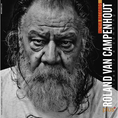 Black and white portrait of a bearded man on a vinyl record sleeve