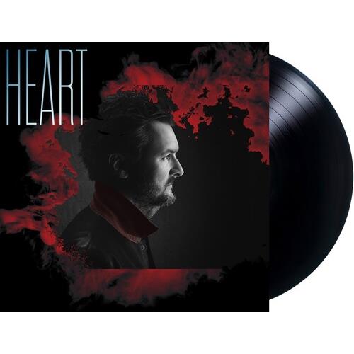 Black vinyl record partially removed from a black album sleeve featuring a profile portrait of a man