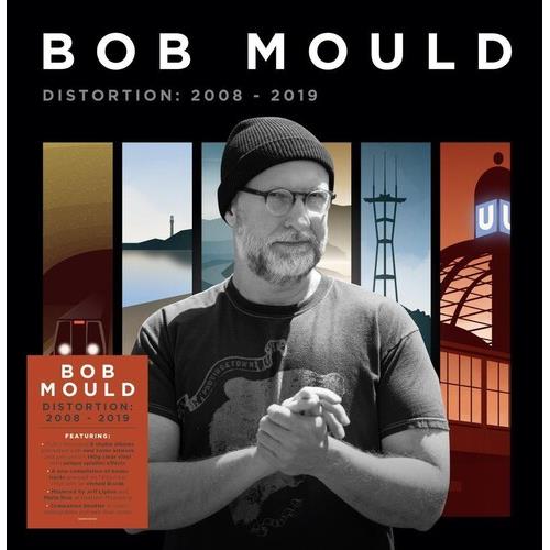 Vinyl LP cover featuring a black and white portrait of a man with glasses and a beanie against a col