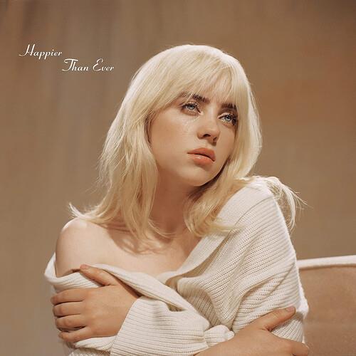 Portrait of a blonde woman in a cream ribbed sweater with a tear on her cheek