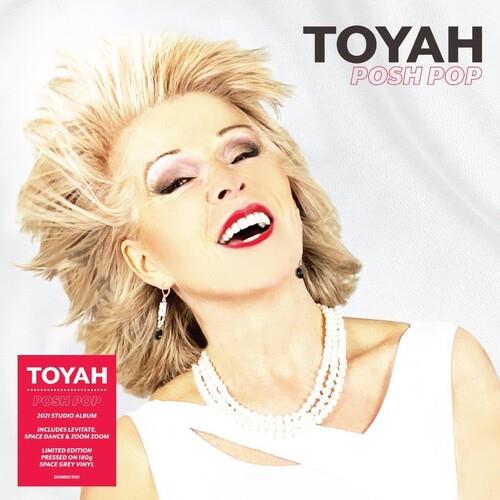 Album cover featuring a woman with spiky blonde hair, red lipstick, and a white top