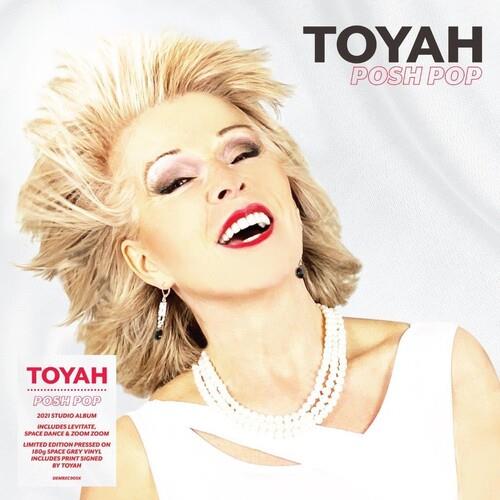 Album cover featuring a woman with spiky blonde hair, red lipstick, and a white top