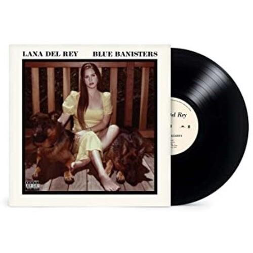 Vinyl LP in a white sleeve featuring a woman in a yellow dress seated with two dogs