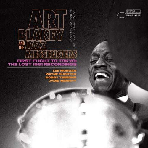 Black and white album cover featuring a drummer smiling behind a drum kit