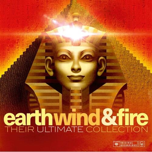 Gold pharaoh mask with glowing light on forehead against a red and orange pyramid background