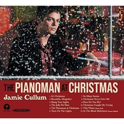 Vinyl LP cover featuring a man in a dark jacket playing piano in falling snow