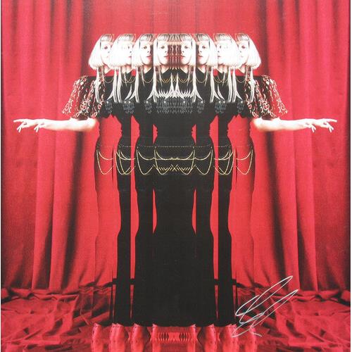 Black vinyl LP cover featuring a mirrored figure in a black dress with gold chains against a red cur