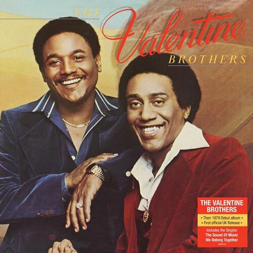 Vinyl LP cover featuring two smiling men in blue and red jackets against a warm gradient background