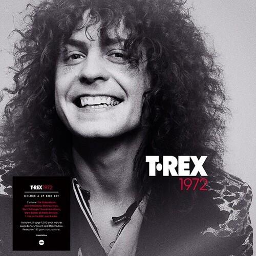 Black and white portrait of a smiling man with curly hair on a vinyl box set cover