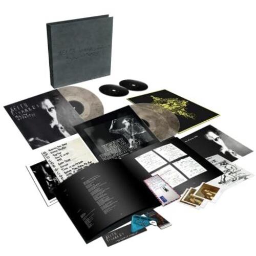 Deluxe vinyl boxset with black slipcase, two LPs, two CDs, and a photo book