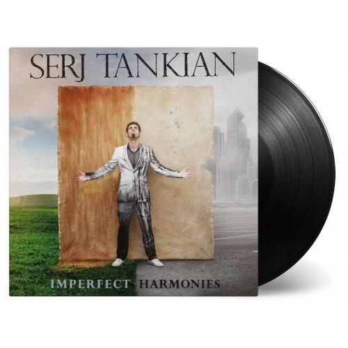 Black vinyl record partially removed from album sleeve featuring a man standing before a large canva
