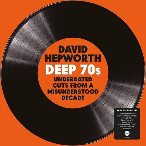 Black vinyl record with orange center label and black typography