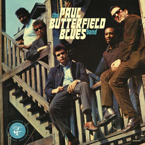 Vintage vinyl LP cover featuring a band posing on wooden stairs with bold typography