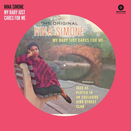 Picture disc vinyl LP featuring a portrait of a woman in a red plaid shirt seated on a park bench