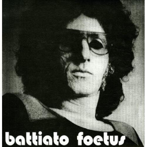 Black and white portrait of a man with curly hair and sunglasses on a vinyl record sleeve