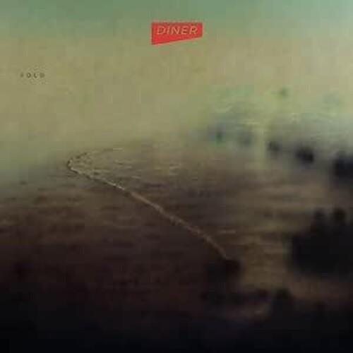 Vinyl LP cover with a misty landscape and a red logo sticker