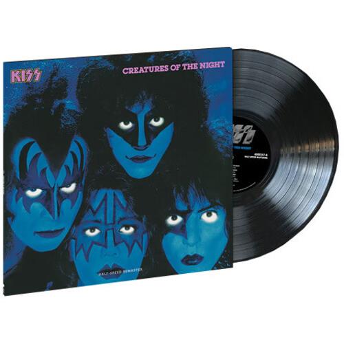 Black vinyl record partially removed from blue and black album cover featuring four faces in face pa