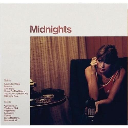 Vinyl LP cover featuring a woman seated in a dimly lit room holding a telephone