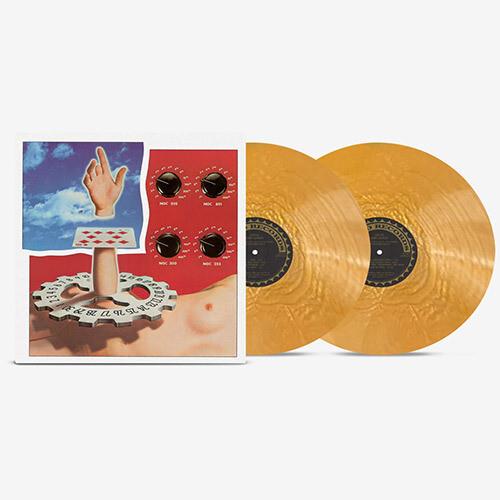 Gold marbled vinyl records displayed next to an album cover featuring a hand and control knobs