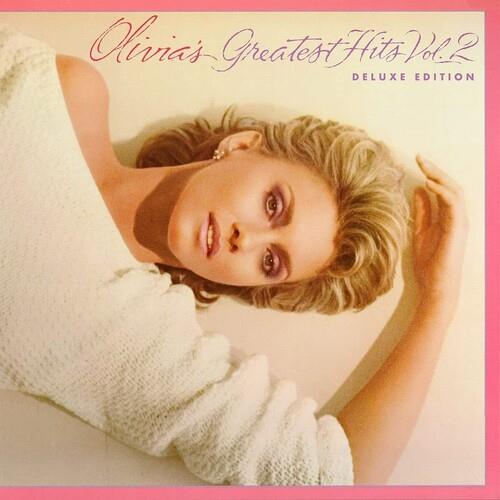 Vinyl record album cover featuring a woman with blonde hair wearing a white knit sweater against a p