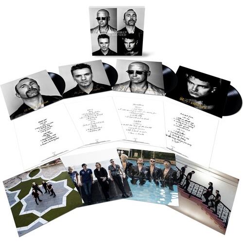 Four black vinyl records with black-and-white portrait sleeves and lyric sheets