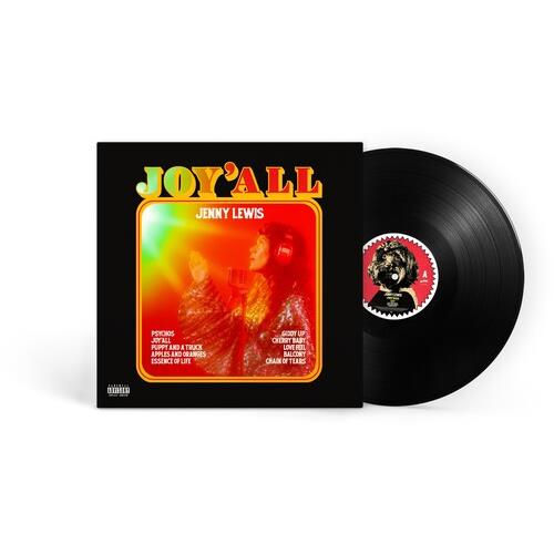 Black vinyl record with a colorful album cover featuring a woman in a sparkly outfit