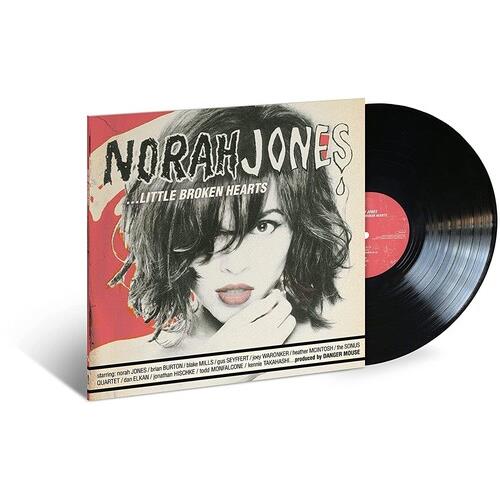 Vinyl LP with a red and cream illustrated cover featuring a woman's portrait and black vinyl record
