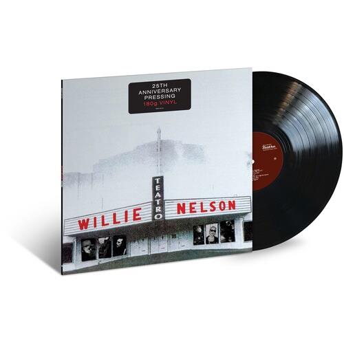 Black vinyl record partially removed from a white album sleeve featuring a theater marquee with red