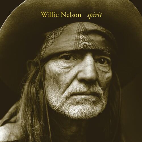 Sepia-toned portrait of a man with a gray beard wearing a wide-brimmed hat and patterned bandana